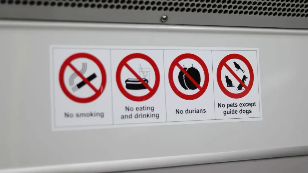 sticker with rules while riding on a subway in singapore