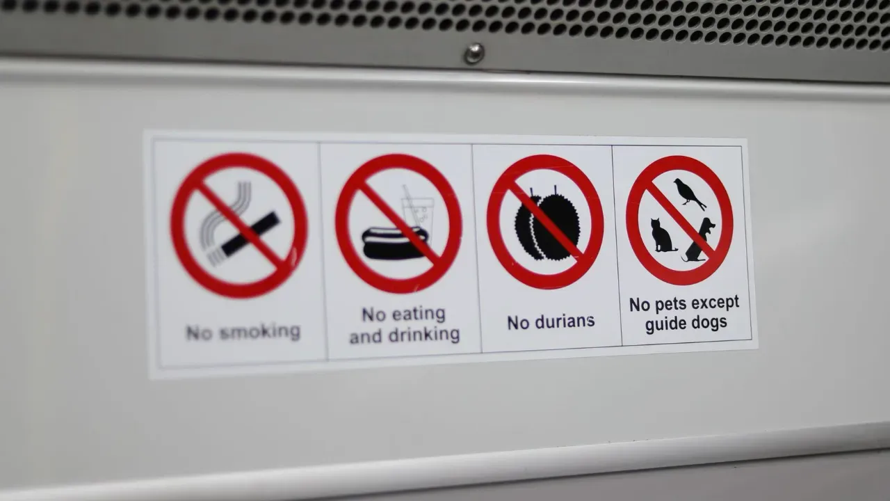 sticker with rules while riding on a subway in singapore