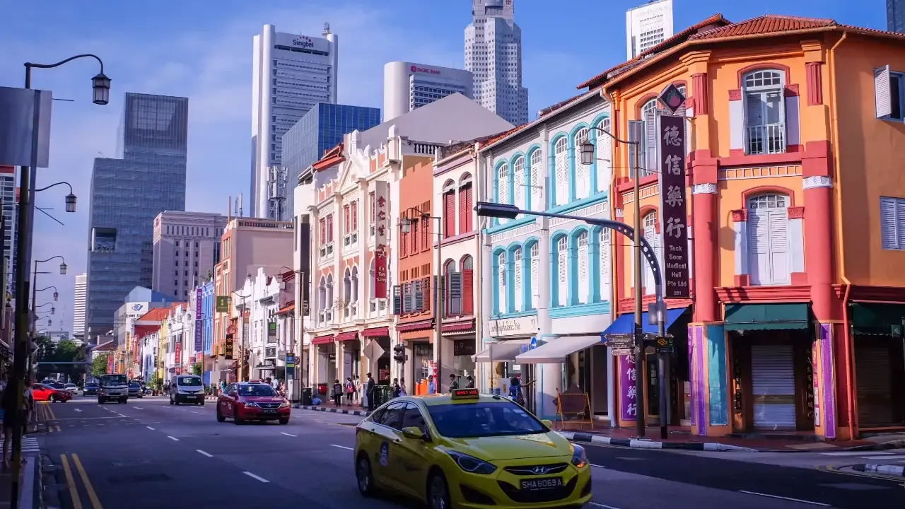 singapore traditional houses with skyscrapers in background