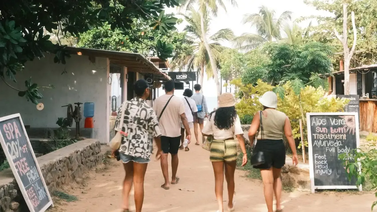 tourists in trincomalee heading towards beach